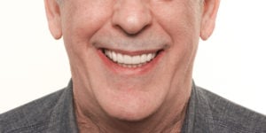  Implant Retained Fixed Prosthesis on a smiling man